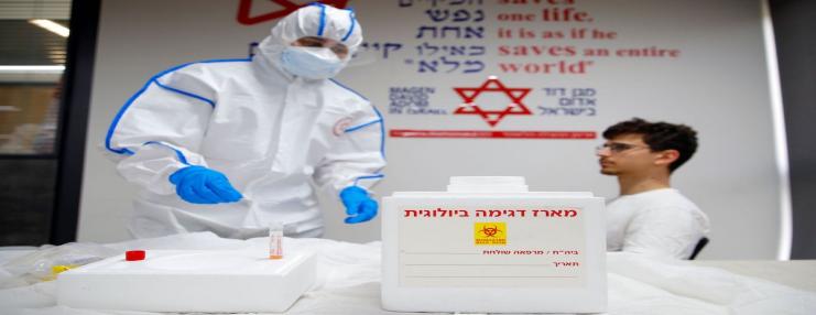 Israeli Paramedics of the Israel's National Emergency Pre-Hospital Medical Organisation at the coronavirus national operations center, perform a coronavirus test exercise on a volunteer on 26 February 2020 in the central Israeli city of Kiryat Ono [JACK GUEZ/AFP via Getty Images]